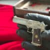 Detailed full metal miniature Desert Eagle slide gun with wood grips