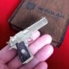 Detailed full metal miniature Desert Eagle slide gun with wood grips