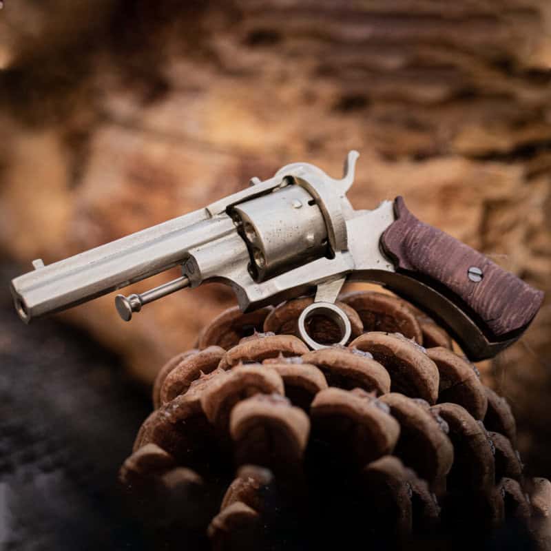 The miniature pinfire revolver Lefaucheux with wooden grips.