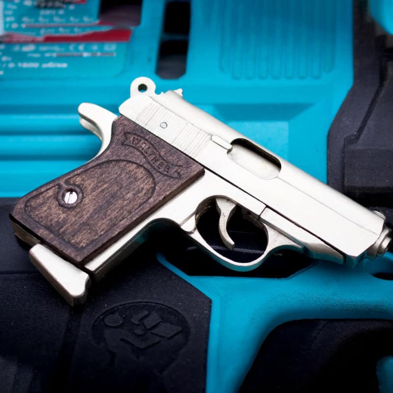 The Walther PPK miniature slide pistol is a full metal gun detailed wood grips.