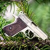 The Walther PPK miniature slide pistol is a full metal gun detailed wood grips.