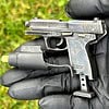 Heckler & Koch USP - a semi-automatic pistol with laser sight