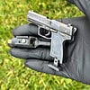 Heckler & Koch USP - a semi-automatic pistol with laser sight