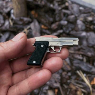 SIG Sauer P220 with black grips (scale 1:4)