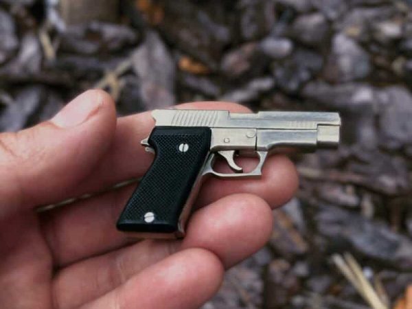 SIG-Sauer-P220-with-Black-Grips-1-scaled-e1771090635216.jpg SIG Sauer P220 with black grips (scale 1:4)